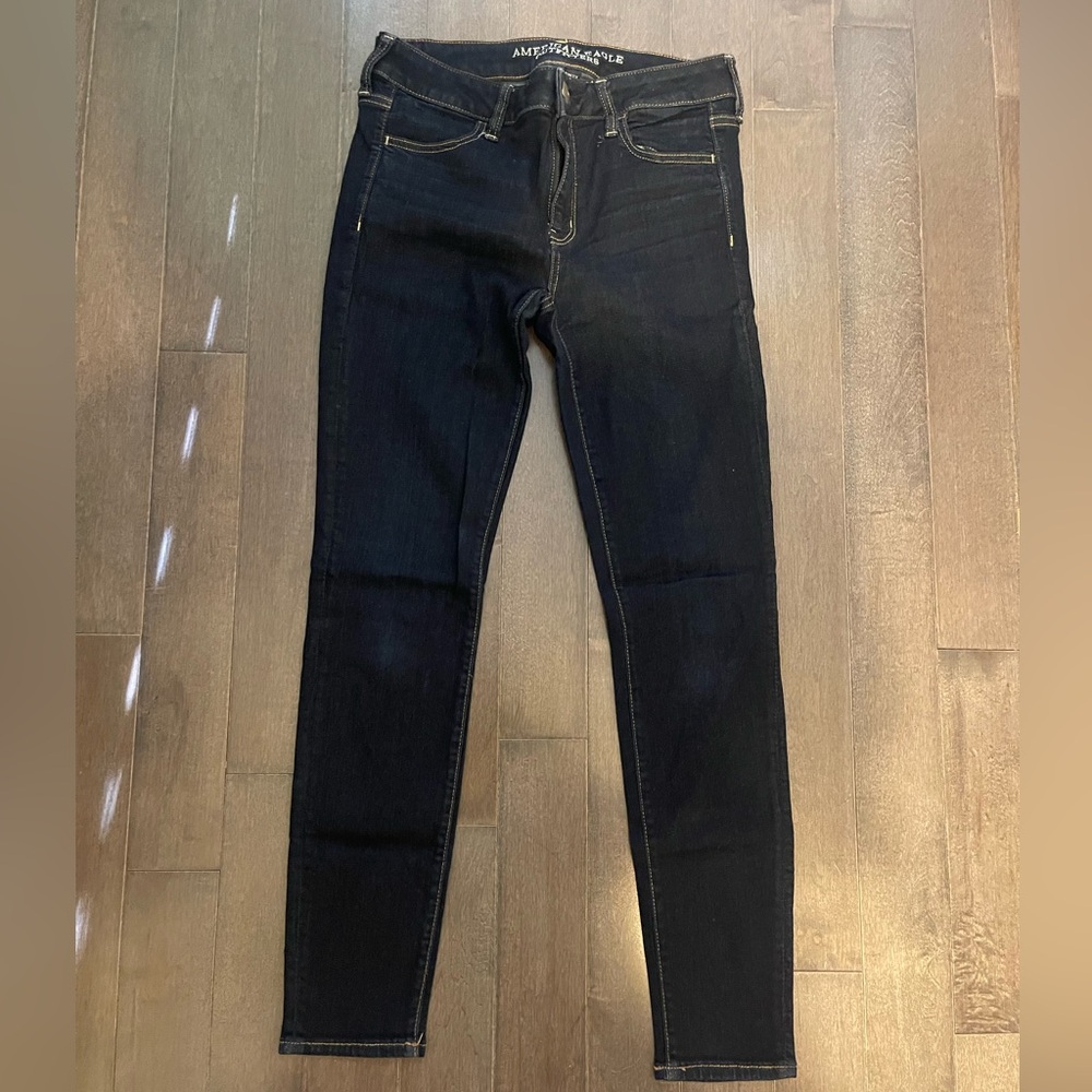 AE dark denim jeans gold seams